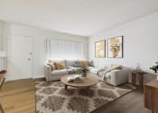 Thumbnail 4 of 65 - A living room with a couch, coffee table, and two framed pictures on the wall.