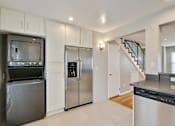 Thumbnail 13 of 24 - a kitchen with stainless steel appliances and white cabinets
