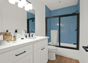 Thumbnail 6 of 95 - a bathroom with a sink toilet and a shower