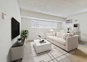 Thumbnail 9 of 61 - A living room with a white couch, a coffee table, and a television.