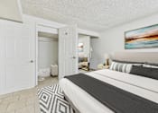 Thumbnail 2 of 61 - A bedroom with a large bed and a painting on the wall.
