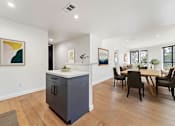 Thumbnail 46 of 157 - A kitchen with a dining table and chairs.