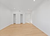 Thumbnail 88 of 119 - A room with wooden flooring and white walls.