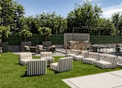 Thumbnail 2 of 25 - Cozy outdoor space featuring a fire pit and contemporary lounge seating