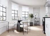 Thumbnail 12 of 25 - Bright dining space featuring contemporary finishes and stylish furnishings.
