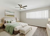 Thumbnail 7 of 18 - a bedroom with a bed and a ceiling fan