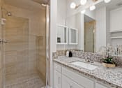 Thumbnail 9 of 18 - a bathroom with a sink and a shower