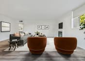 Thumbnail 4 of 29 - Two orange chairs are placed in a room with a grey couch and a coffee table.