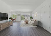 Thumbnail 16 of 30 - A living room with a grey floor and white walls.