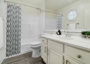 Thumbnail 5 of 17 - a bathroom with a sink and a toilet and a shower