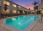 Thumbnail 76 of 78 - A swimming pool in a residential area surrounded by buildings.
