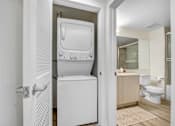Thumbnail 8 of 90 - A white bathroom with a walk-in shower and a toilet.