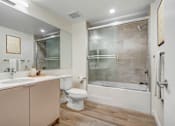 Thumbnail 9 of 90 - A modern bathroom with a walk-in shower and a toilet.