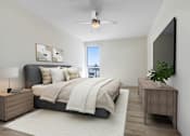 Thumbnail 6 of 90 - A bedroom with a bed, nightstand, and a ceiling fan.