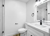 Thumbnail 24 of 26 - a bathroom with a sink toilet and a shower