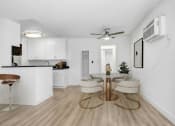 Thumbnail 16 of 95 - an open kitchen and dining room with a table and chairs