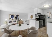 Thumbnail 13 of 95 - an apartment living room and kitchen with a table and chairs
