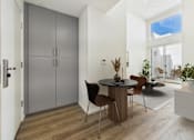 Thumbnail 5 of 61 - A modern dining room with a table set for two.