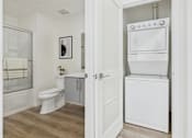 Thumbnail 19 of 61 - A white toilet and sink in a bathroom.