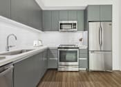 Thumbnail 1 of 45 - A modern kitchen with a stainless steel refrigerator and oven.