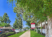 Thumbnail 34 of 36 - A sign for a Valley Terrace Apartment Complex is displayed on a street.