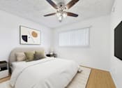 Thumbnail 6 of 13 - A bedroom with a bed, nightstand, and a ceiling fan.