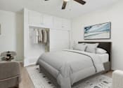Thumbnail 3 of 12 - A bedroom with a large bed and a ceiling fan.