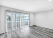 Thumbnail 88 of 102 - the living room has a sliding glass door to the patio