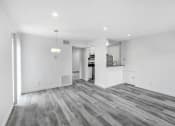 Thumbnail 85 of 102 - the living room and kitchen of a new home with white walls and wood flooring