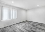 Thumbnail 87 of 102 - an empty room with white walls and a window with white blinds