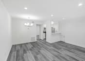 Thumbnail 92 of 102 - the living room and kitchen in a new home with white walls and wood flooring