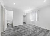 Thumbnail 97 of 102 - a renovated living room with white walls and wood flooring