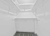Thumbnail 18 of 24 - A white room with a grey carpet and white walls.