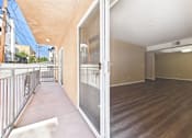 Thumbnail 23 of 30 - A balcony with a metal railing and a view of the street.