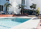 Thumbnail 20 of 76 - Courtyard Resort-style heated pool with lounge chairs