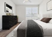 Thumbnail 4 of 40 - A bedroom with a large bed and a dresser.
