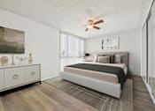 Thumbnail 6 of 73 - A bedroom with a bed, dresser, and a ceiling fan.