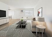 Thumbnail 5 of 73 - A modern living room with a black coffee table and a large flat screen TV.