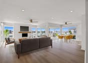 Thumbnail 5 of 135 - a living room with a couch and a table and a television