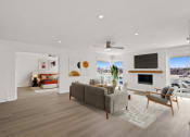 Thumbnail 4 of 135 - a living room with a couch and a chair and a fireplace