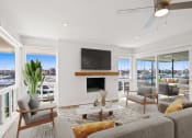 Thumbnail 6 of 135 - a living room with a couch and chairs and a television
