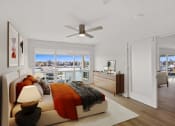 Thumbnail 18 of 135 - an apartment bedroom with a bed and a ceiling fan