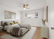 Thumbnail 17 of 135 - a bedroom with a bed and a ceiling fan