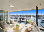 Thumbnail 11 of 135 - a living room with a view of a marina