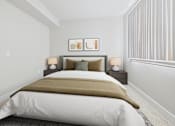 Thumbnail 40 of 53 - A bed with a white comforter and a brown throw is in a room with two lamps on the bedside tables.