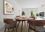 Thumbnail 37 of 53 - A dining room with a wooden table and chairs.