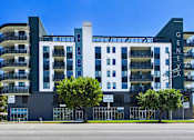 Thumbnail 162 of 163 - A modern multi-story building with the name "Geneva" on the top right corner.