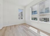 Thumbnail 74 of 163 - A room with a window overlooking a building.