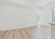 Thumbnail 83 of 163 - A room with wooden flooring and white walls.