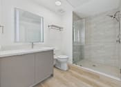 Thumbnail 89 of 163 - A modern bathroom with a walk-in shower and a toilet.